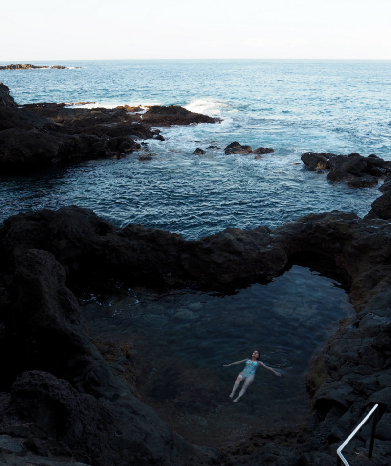 Thoughts I Had in Tenerife - Elle floats in a volcanic rock pool