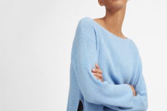 Woman in blue Everlane cashmere jumper: How to Create an Ethical Winter Wardrobe