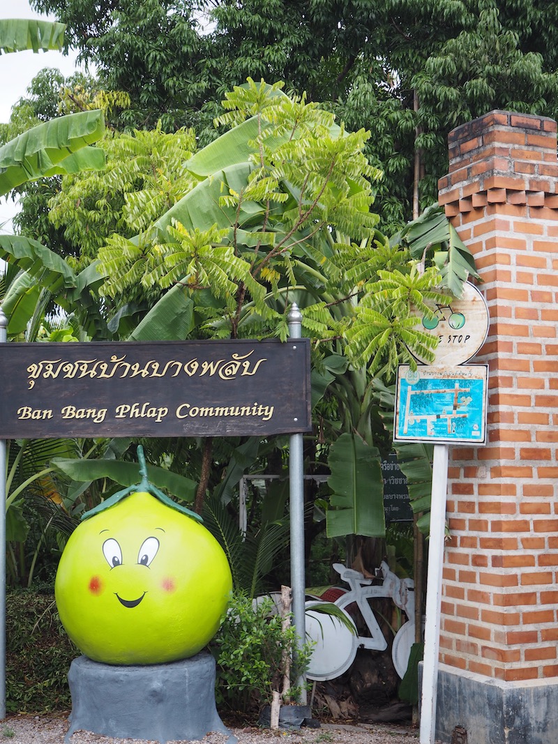 Sign and pomelo statue, Ban Bang Phlap Community Centre, Thailand