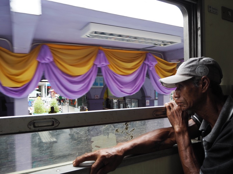 Man on the train from Wongwian Yai Railway Station, Bangkok